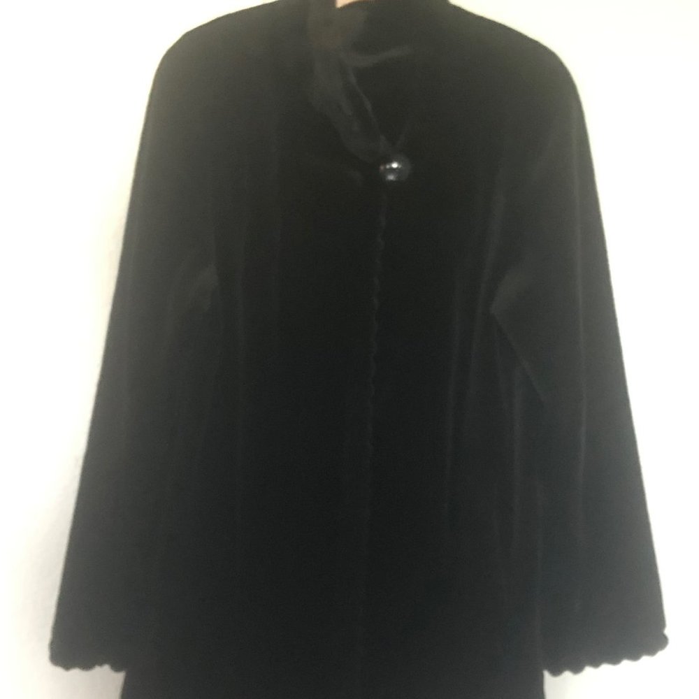 Mink jacket with fancy trimmed sleeves and closing.  Sheared mink, very soft